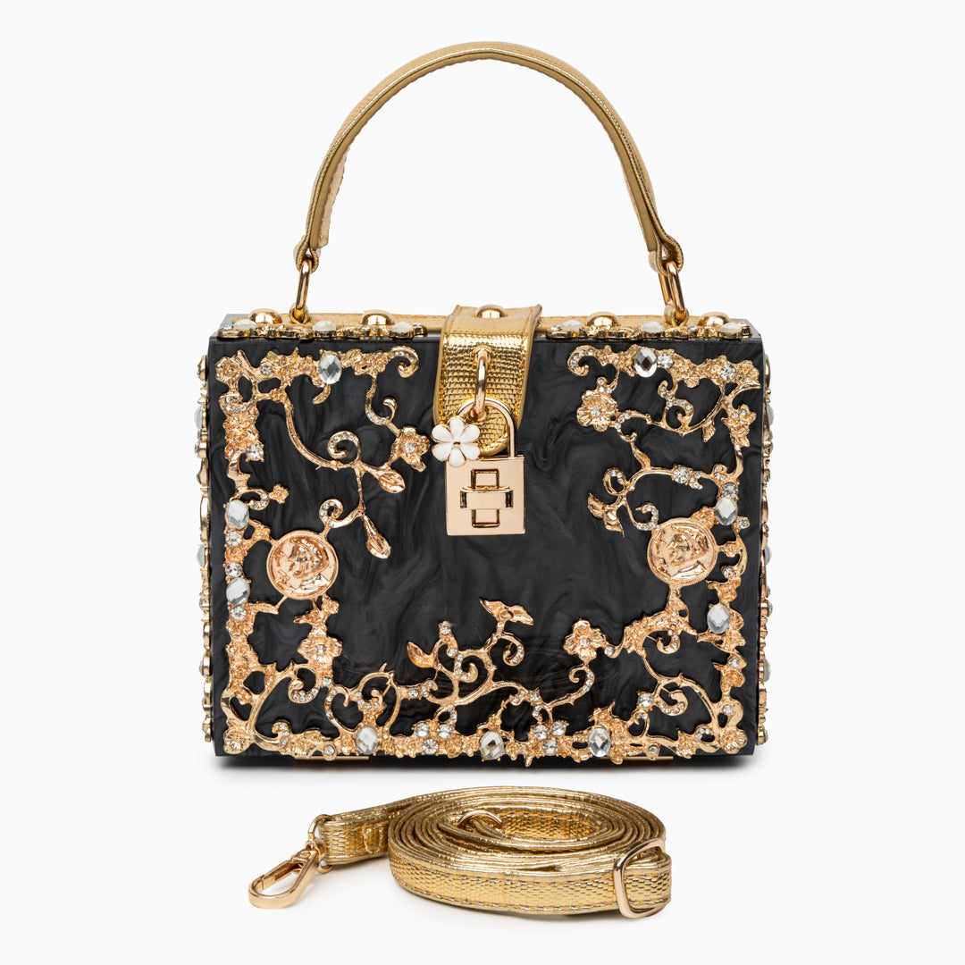 Bolso rígido tipo box con detalles florales