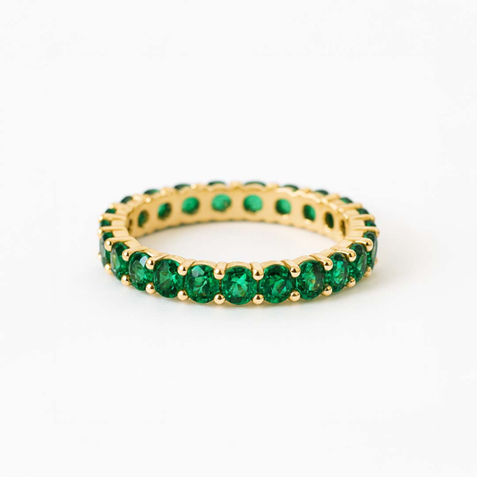 Anillo tipo alianza con circonitas verdes