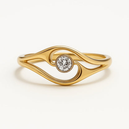 Anillo dorado diseño ojo con circonita central