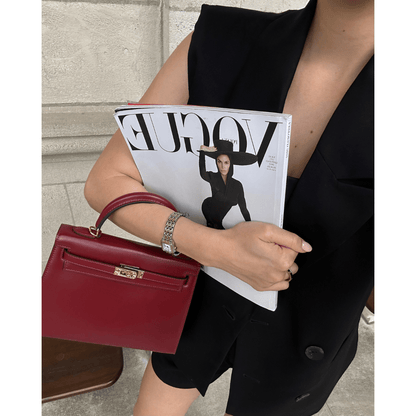 Bolso estructurado de mano con solapa
