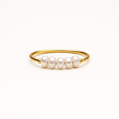 Anillo fino dorado con perlas alineadas