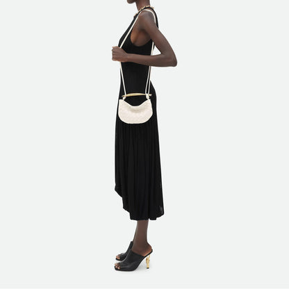Bolso compacto trenzado con asa rígida
