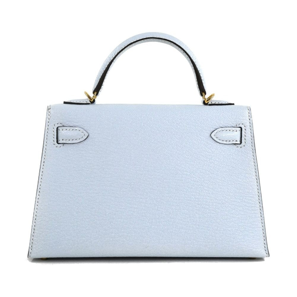 Bolso estructurado de mano con solapa