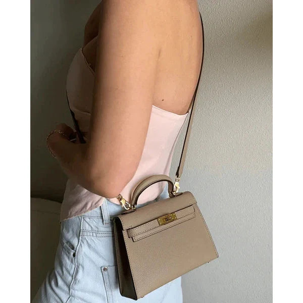 Bolso estructurado de mano con solapa