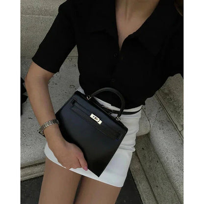 Bolso estructurado de mano con solapa