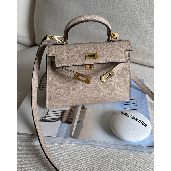 Bolso estructurado de mano con solapa