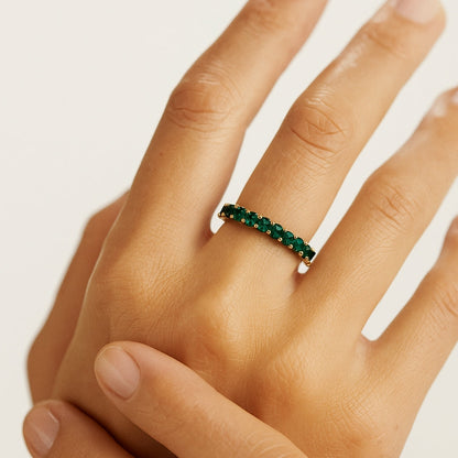 Anillo tipo alianza con circonitas verdes