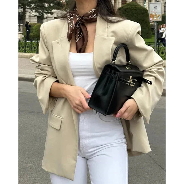 Bolso estructurado de mano con solapa