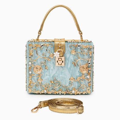 Bolso rígido tipo box con detalles florales