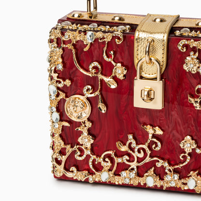 Bolso rígido tipo box con detalles florales