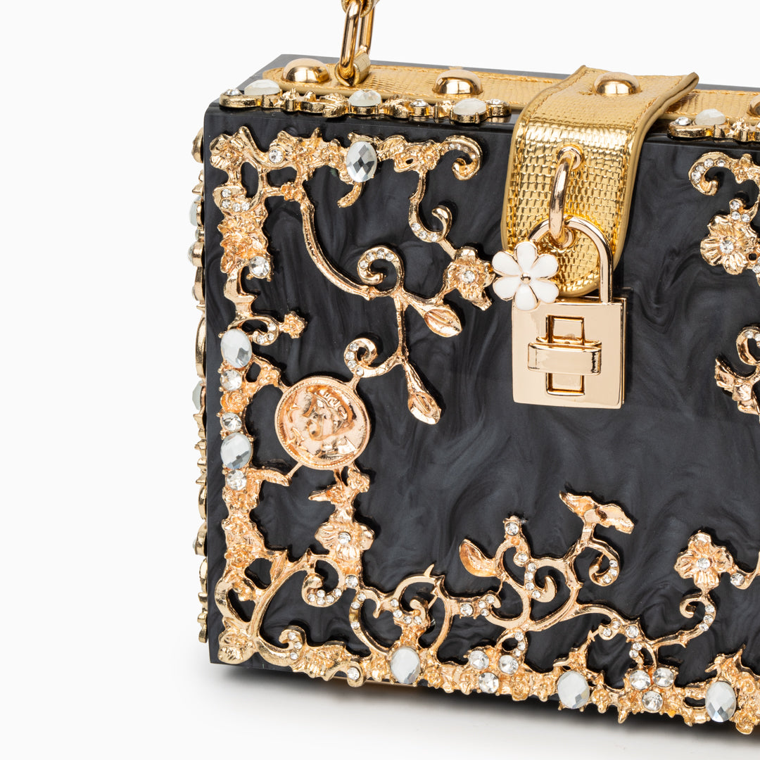 Bolso rígido tipo box con detalles florales
