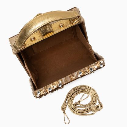 Bolso rígido tipo box con detalles florales
