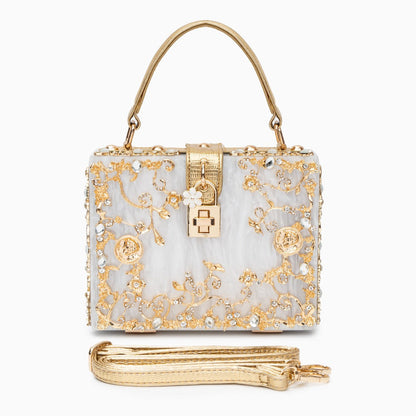 Bolso rígido tipo box con detalles florales