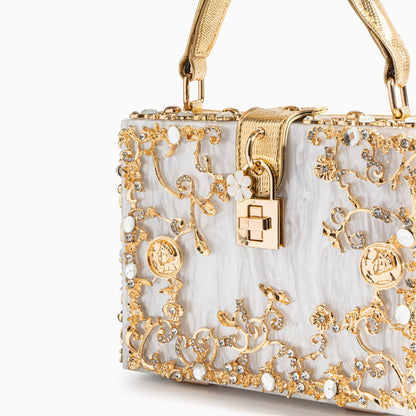 Bolso rígido tipo box con detalles florales