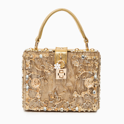 Bolso rígido tipo box con detalles florales