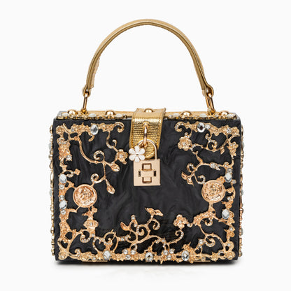 Bolso rígido tipo box con detalles florales