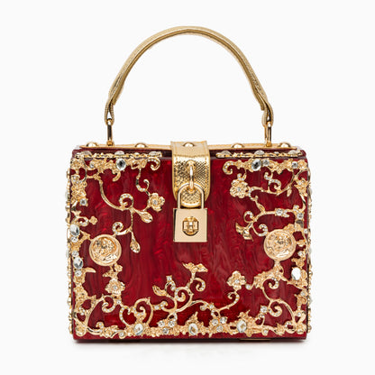 Bolso rígido tipo box con detalles florales