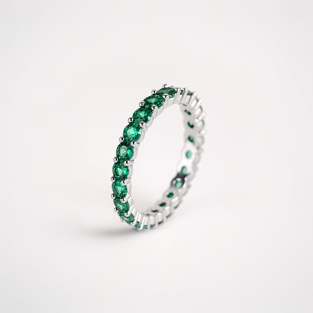 Anillo tipo alianza con circonitas verdes