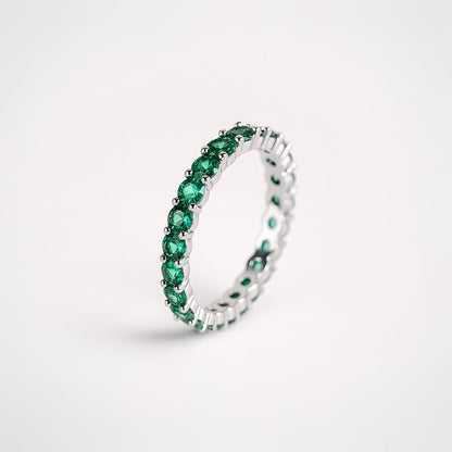 Anillo tipo alianza con circonitas verdes