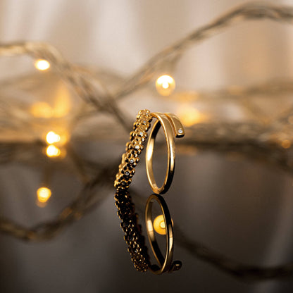 Anillo abierto con circonita lateral